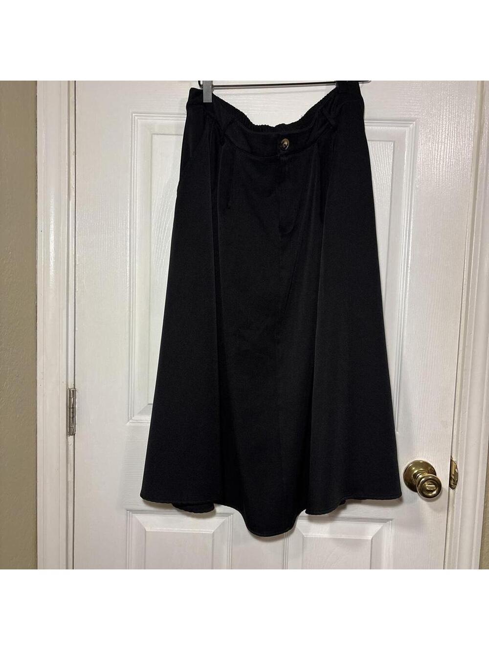 Black midi skirt with button detail and pockets